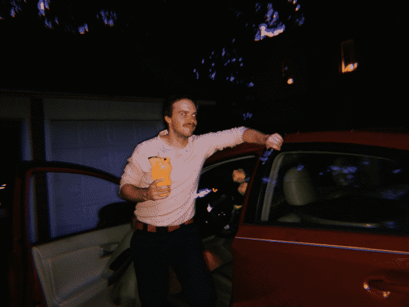A picture of me standing by my Prius and holding a Jar Jar Binks tiki mug.
